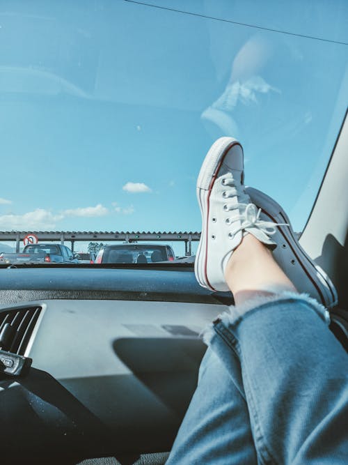 Legs of Person Lying Down in Car