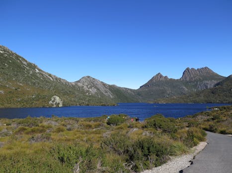 Explore Cradle Mountain and Dove Lake with stunning blue skies and rugged landscapes in Tasmania.