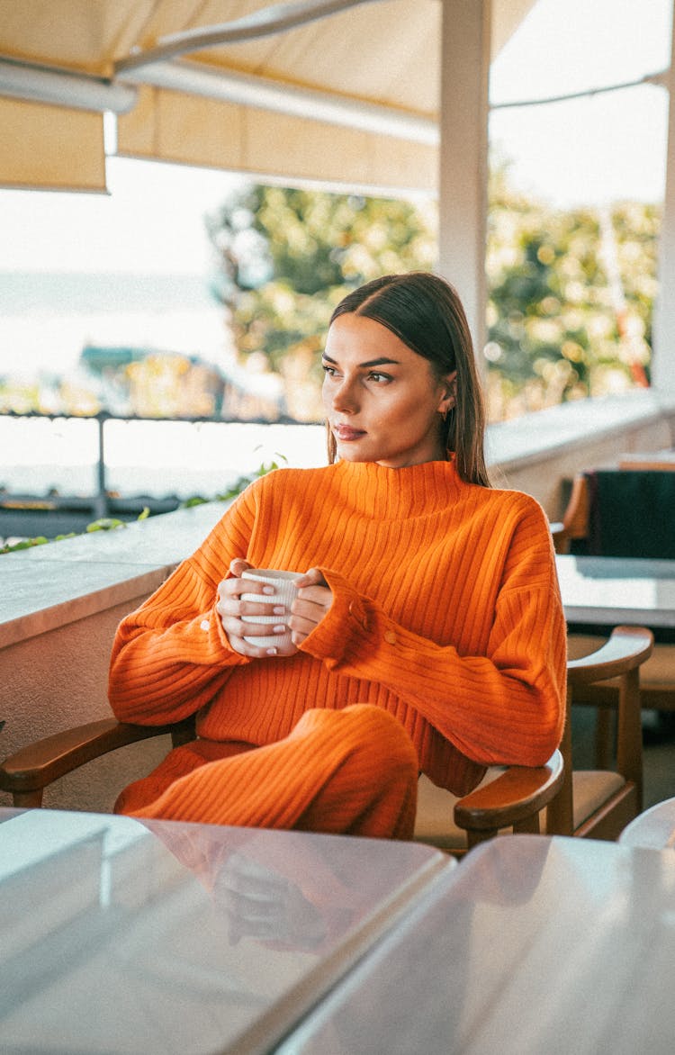 Woman Relaxing In Cafe