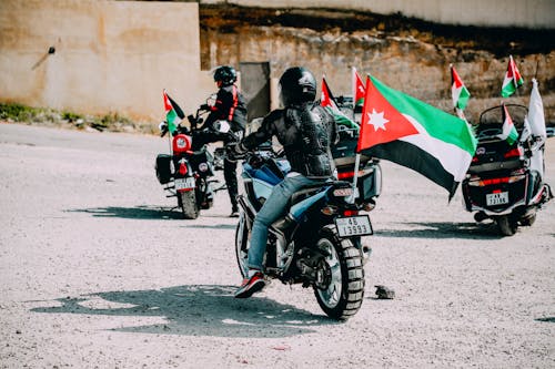 People with Palestinian Flags on Motorbikes