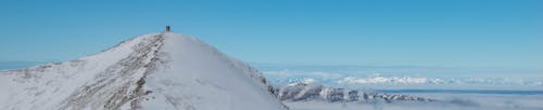 Tower on top of snowy mountain