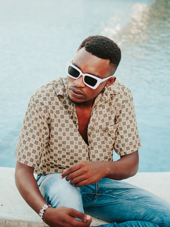 Young Fashionable Man in a Shirt and Sunglasses 