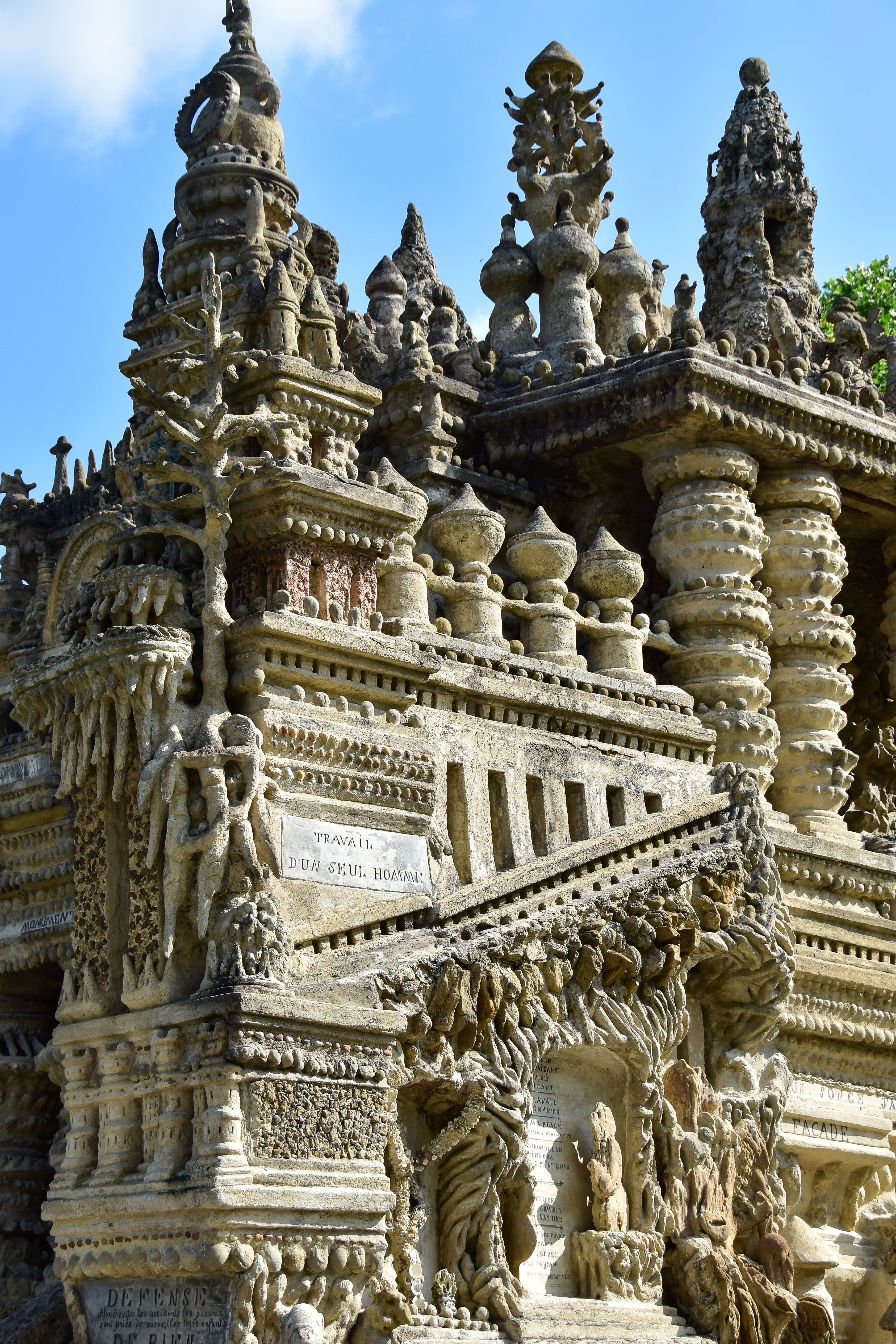 [ColoSach]-explore-the-elaborate-details-of-palais-idéal's-stunning-stone-carvings-in-hauterives,-france.