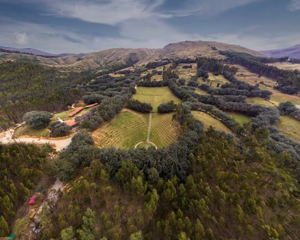 Explore lush landscapes and rolling hills in this aerial view of Cochas, Peru.