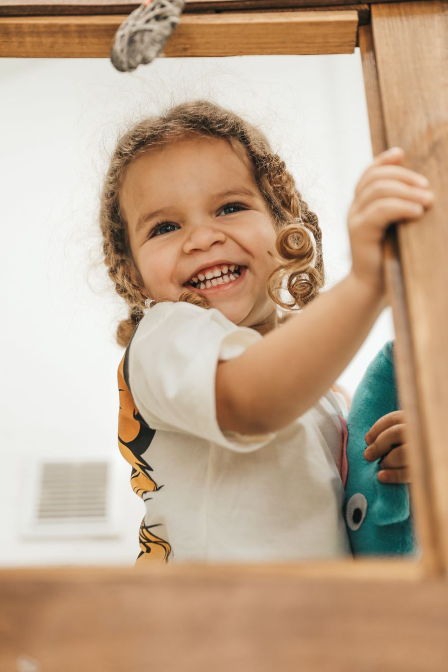 Smiling curly-haired toddler