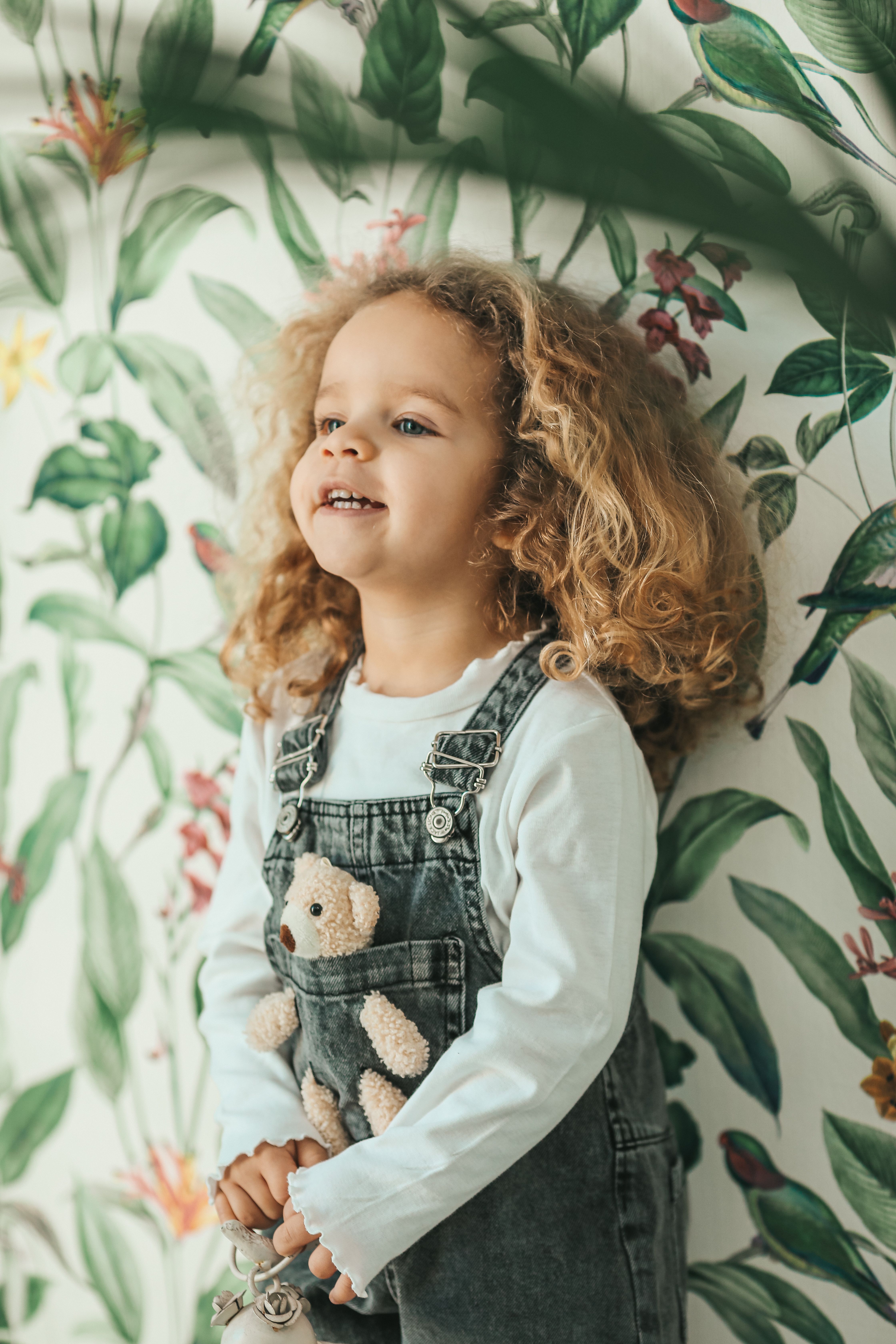 Happy Cute Little Girl in Denim Overalls · Free Stock Photo