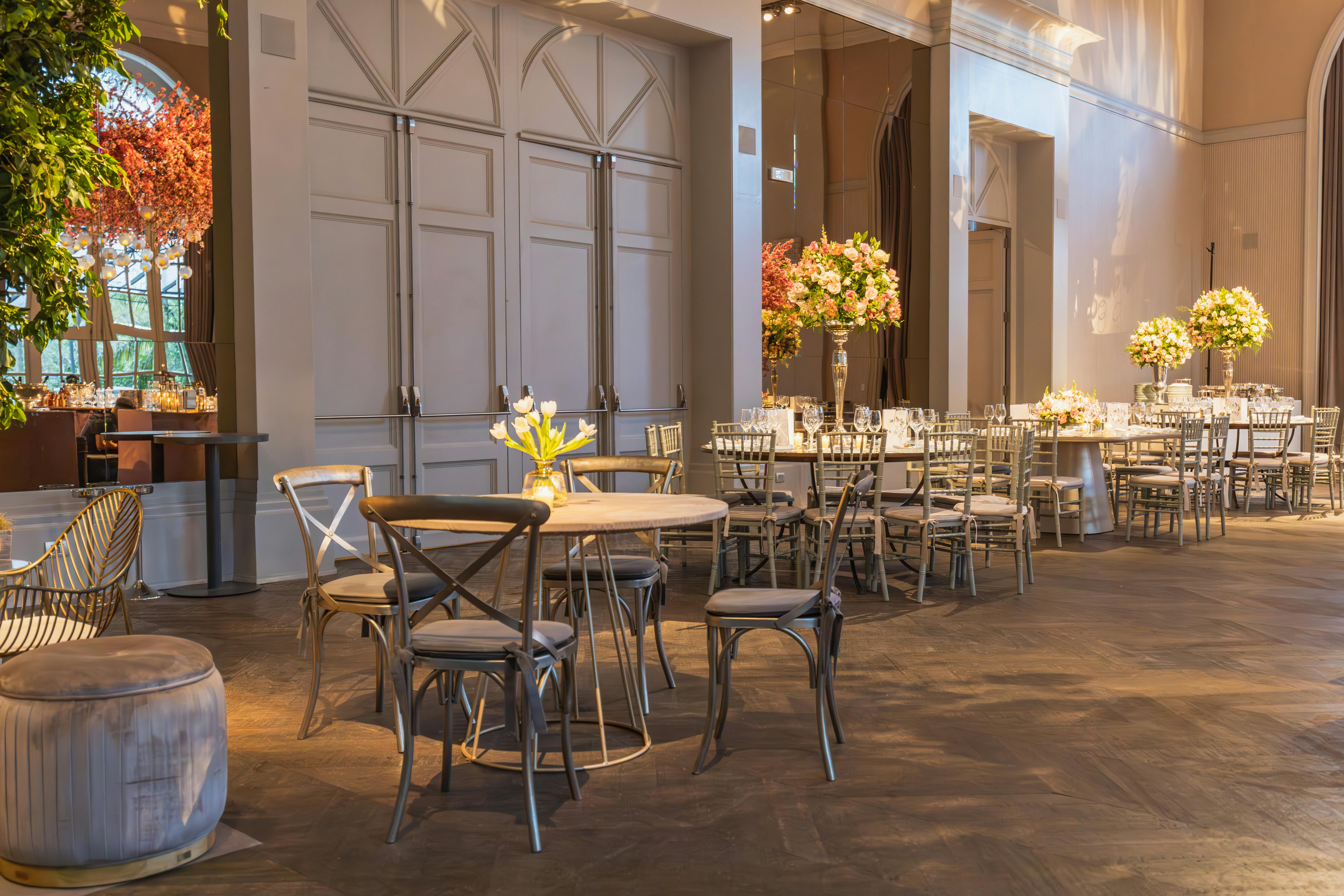 Sophisticated indoor wedding venue with floral decor and elegant furniture setting.