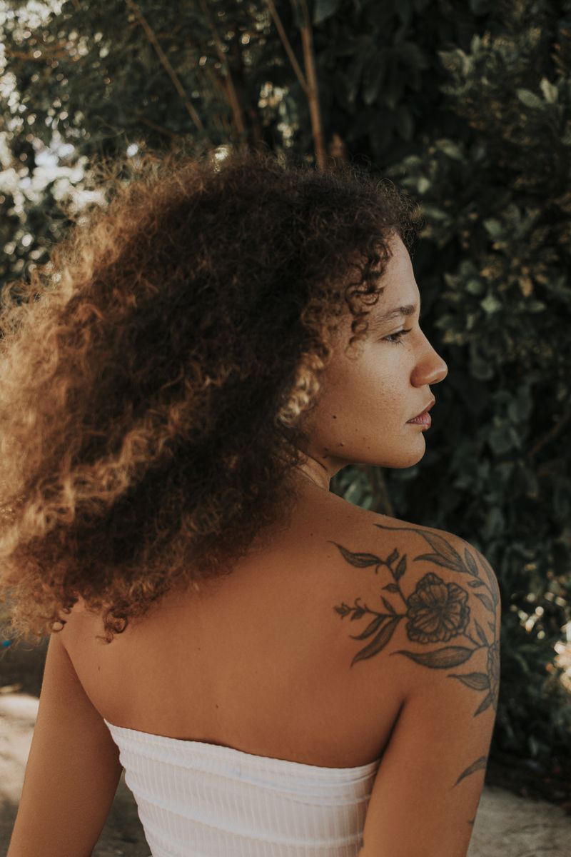 Woman with curly hair from behind
