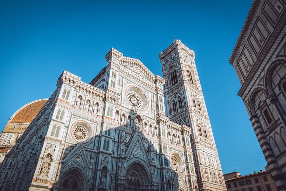 Stunning facade of Florence Cathedral, Italy, showcasing Gothic revival architecture on a clear day.