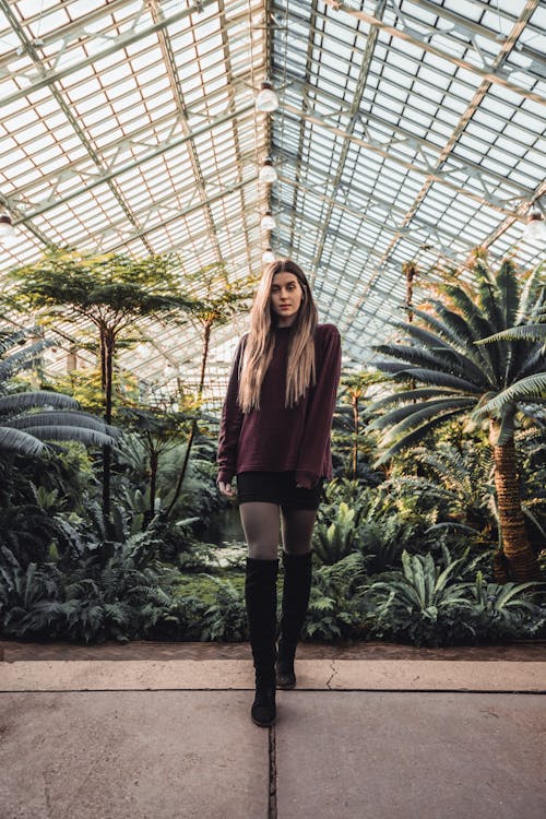 Woman Standing Near Plants