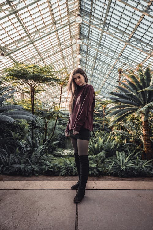 Woman Inside A Greenhouse