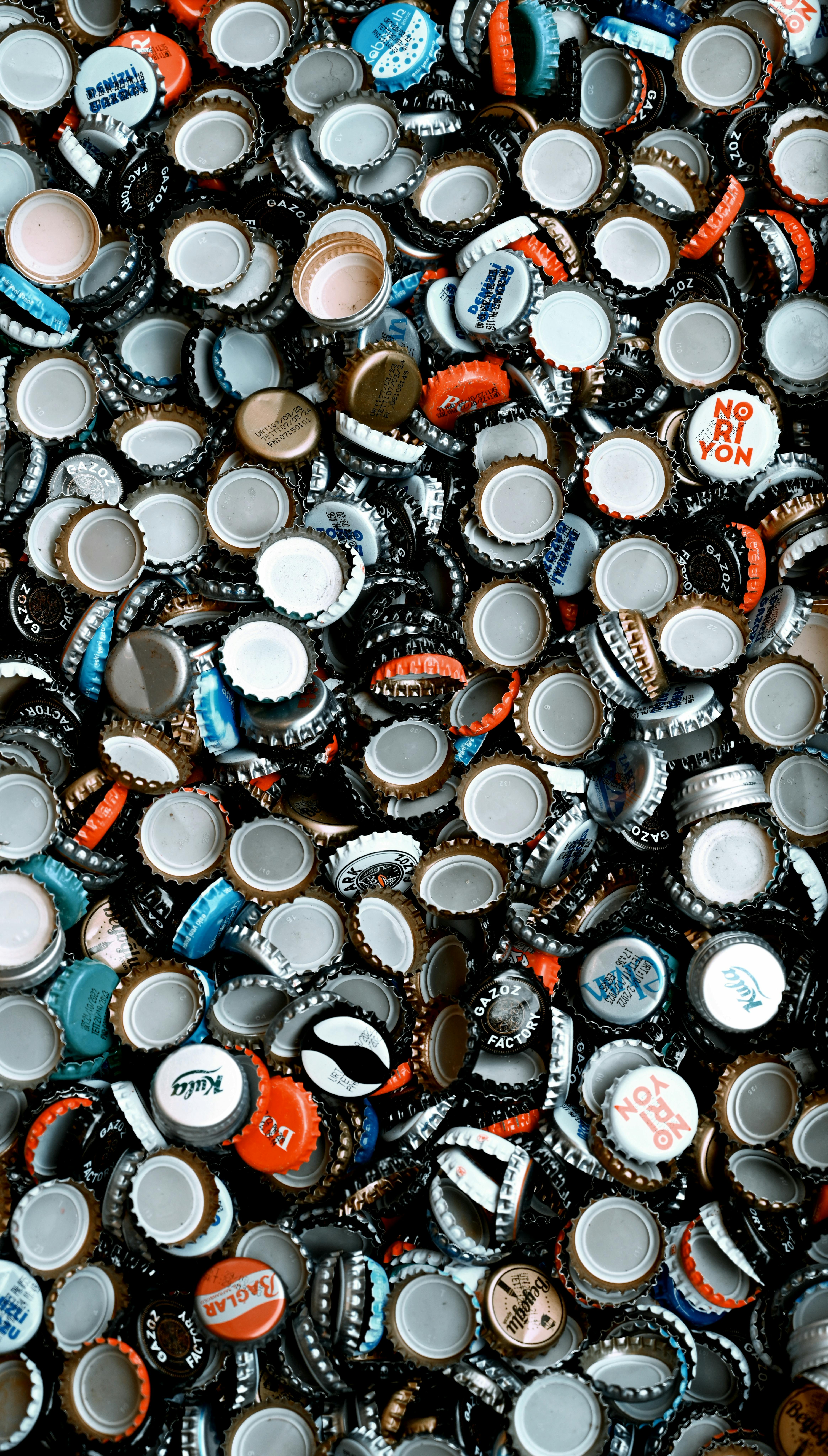 A vibrant collection of assorted metal bottle caps viewed from above in Istanbul, Türkiye.