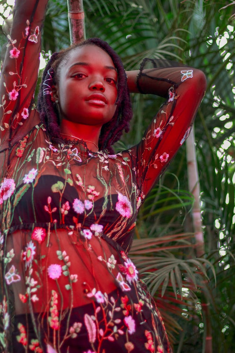 Woman Wearing Black And Multicolored Floral Long-sleeved Dress