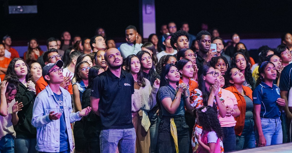 Vibrant crowd dancing and singing at Christ Embassy Loveworld Arena in Ho Ghana Sunday morning service