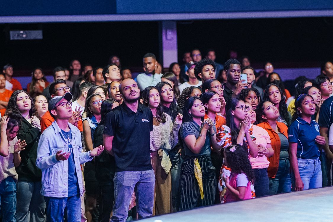 Congregation Crowd Congregation Standing in front of a Stage and Praying · Free Stock Photo