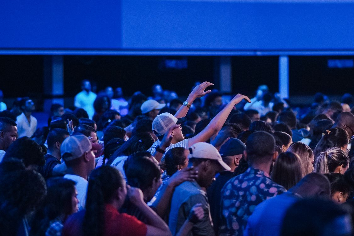 Congregation Crowd People in a Church Standing and Praying · Free Stock Photo