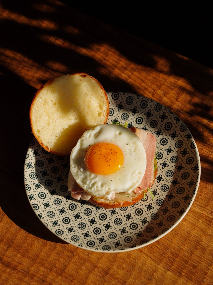 A Bun With Ham And Fried Egg