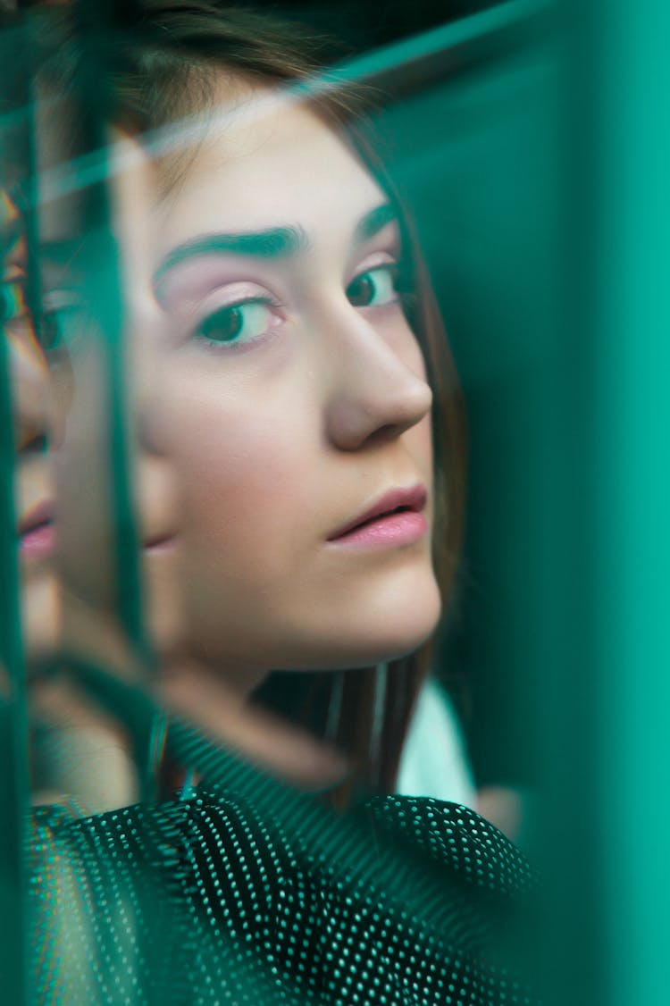 Reflection Of A Woman In A Window