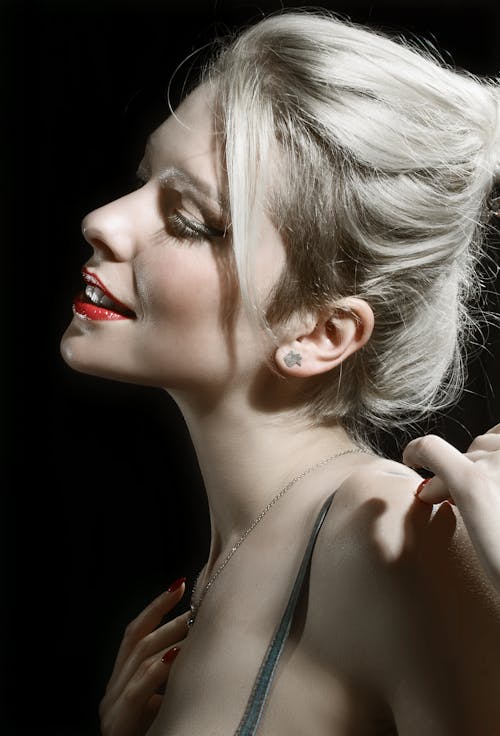 Young Woman with Red Lips Posing in Studio