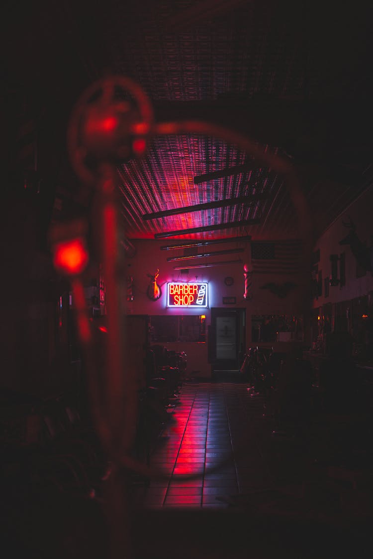 Interior Of An Empty Barber Shop At Night