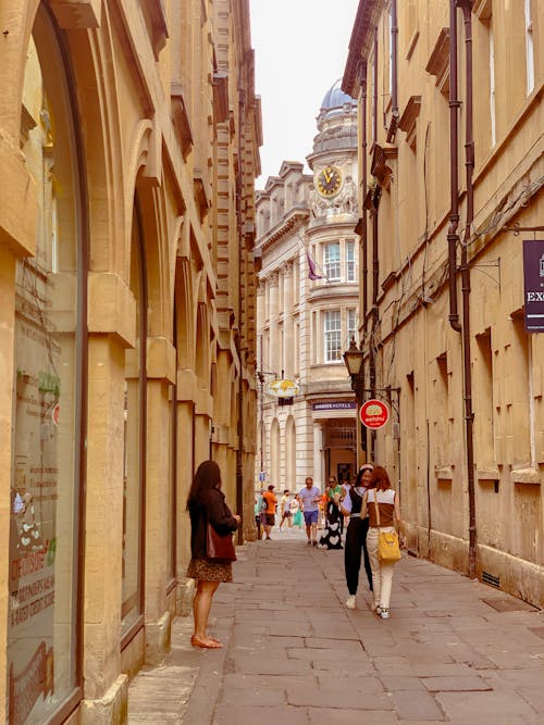 People in Narrow Alley in Town