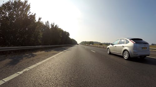 Free Silver Ford Focus 5-door Hatchback Speeding on Road Stock Photo