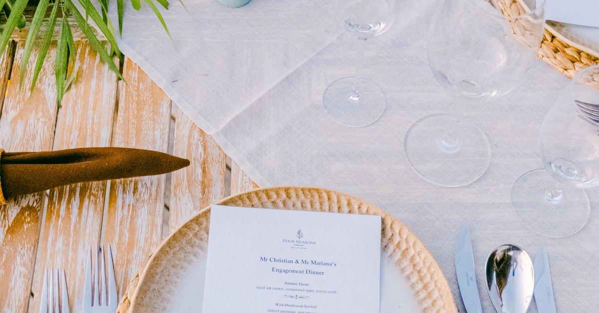 Solid Table Menu Menu and Silverware on Table · Free Stock Photo