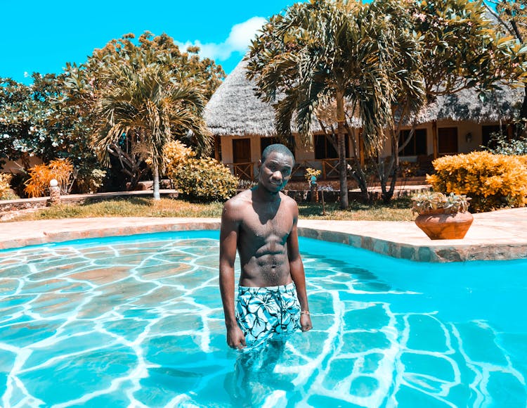 Photo Of Man Standing In Pool