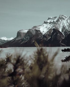 Capture the serene beauty of snow-capped mountains in Banff National Park, Alberta, perfect for nature lovers.