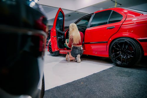 Back View of a Woman Cleaning a Car 