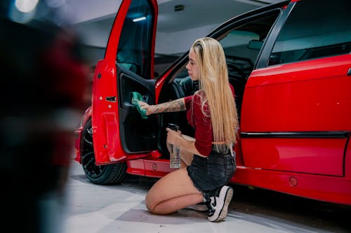 Young Woman Cleaning a Car 