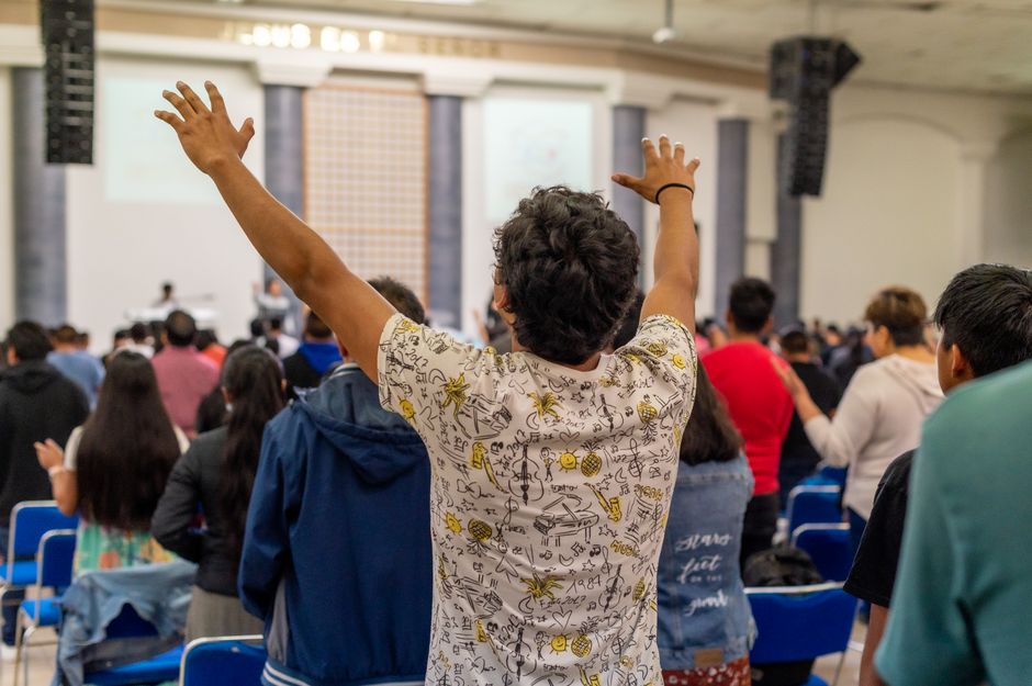 Multicultural church family with hands raised in joyful, Spirit-filled worship - Bible lessons for kids Multicultural church family with hands raised in joyful, Spirit-filled worship - Bible lessons for kids