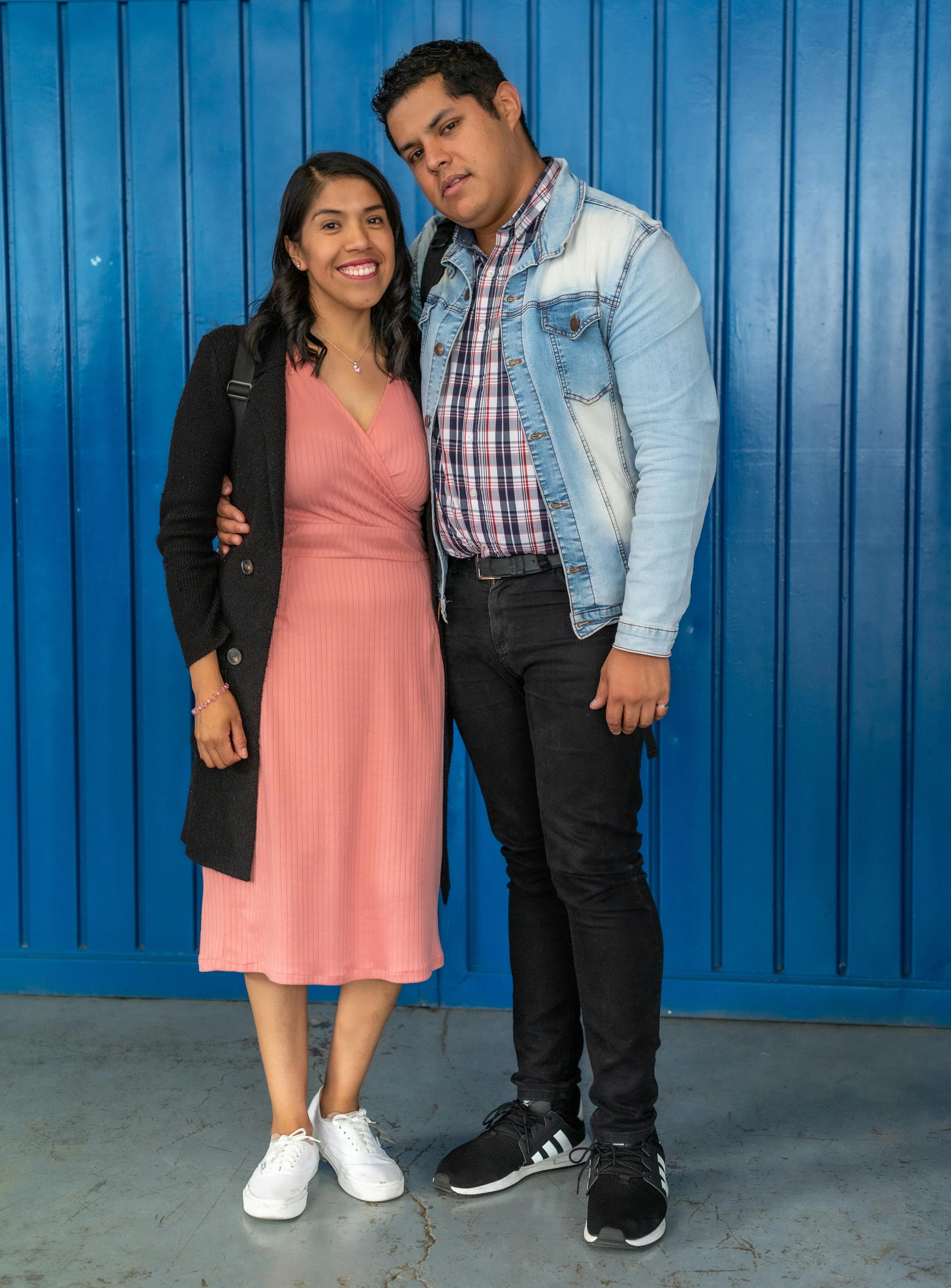 a man and woman standing next to each other