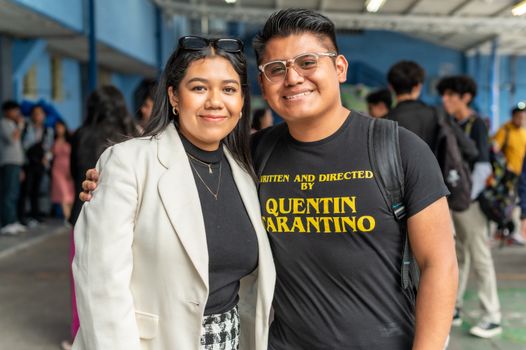 A man and woman standing next to each other