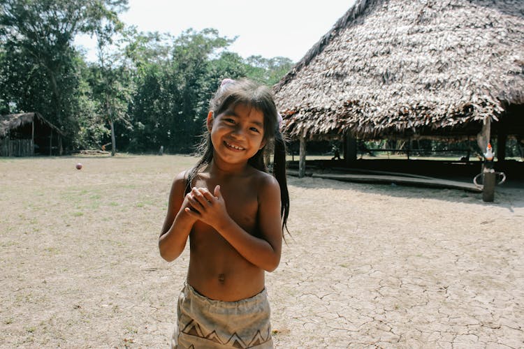 Smiling Girl In Tribal Village