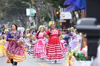 Vibrant cultural festival with traditional dancers parading in colorful costumes in San Francisco.