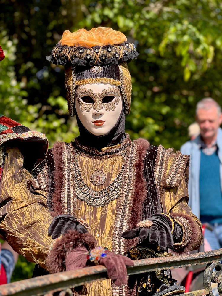 A Person In A Costume And Mask At The Carnival Of Venice 