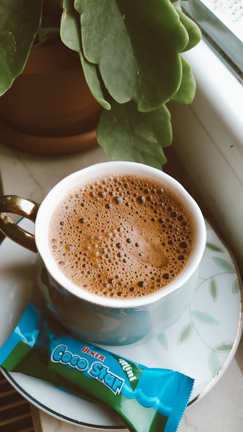 Free A Cup of Black Coffee and a Chocolate Bar  Stock Photo