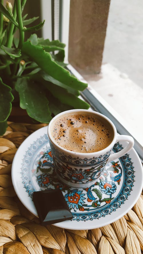 A Cup of Espresso on a Table by the Window