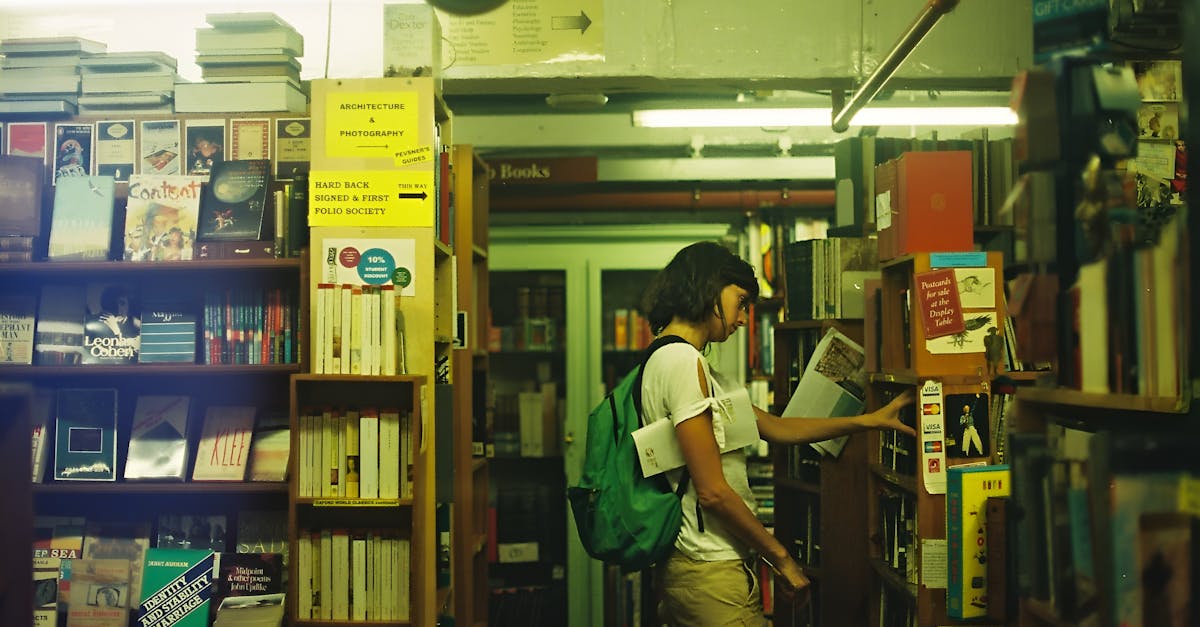 A woman explores a cozy London library, engrossed in book selection.