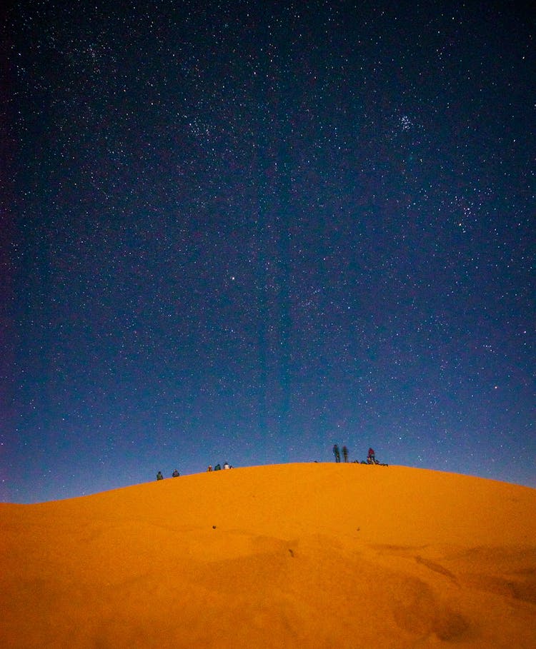 People At The Desert At Night Time