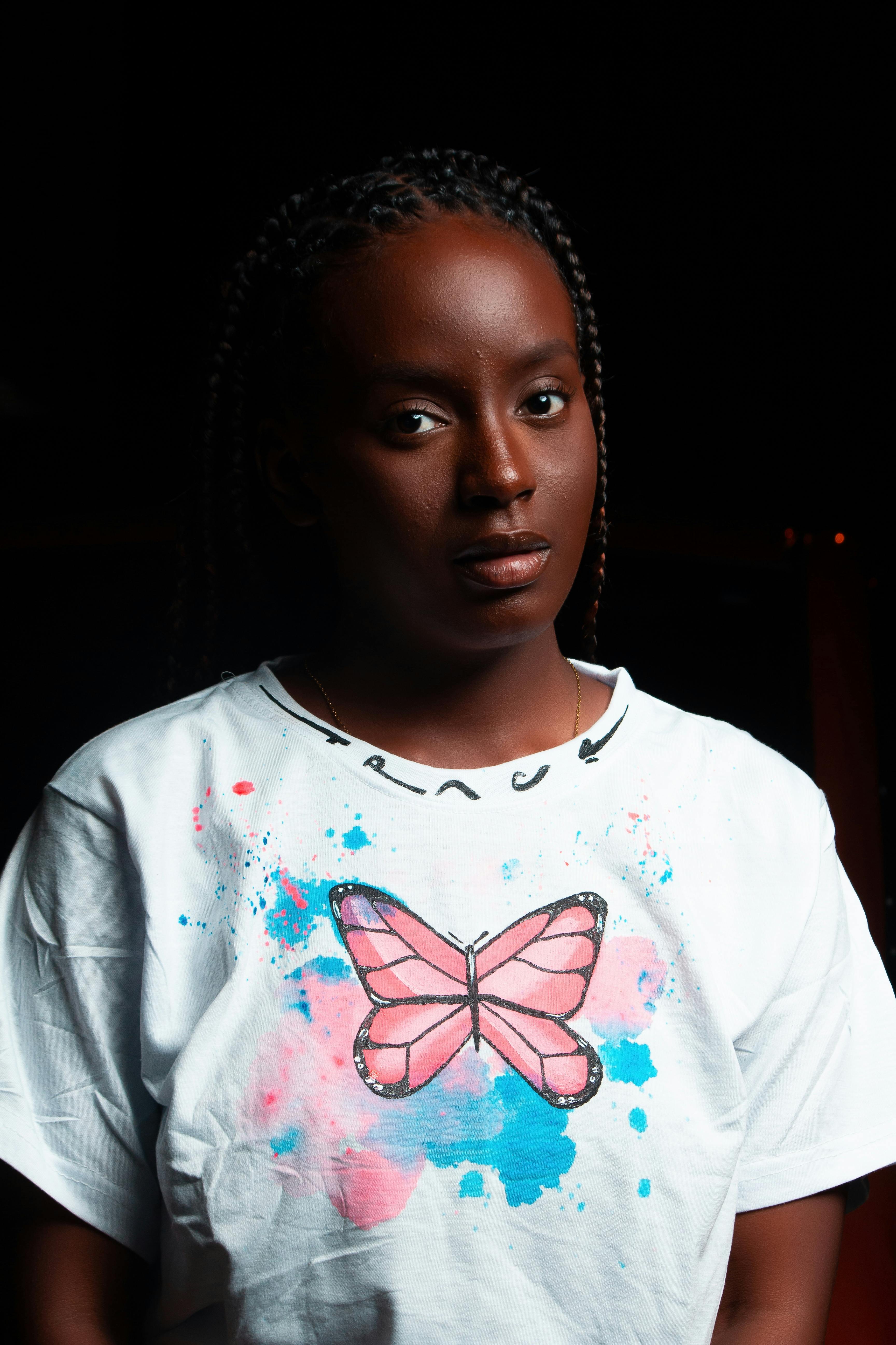 Young Woman in a Football Liverpool FC T-shirt · Free Stock Photo