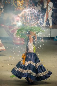 Vibrant traditional dance with pyrotechnics in Oaxaca, capturing Mexican cultural essence.