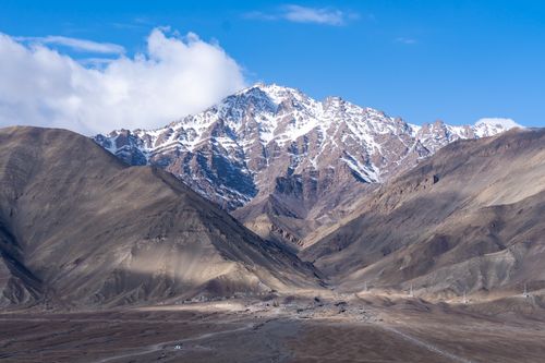 Free Stunning snow-capped mountains in Leh, showcasing rugged and eroded natural beauty. Stock Photo