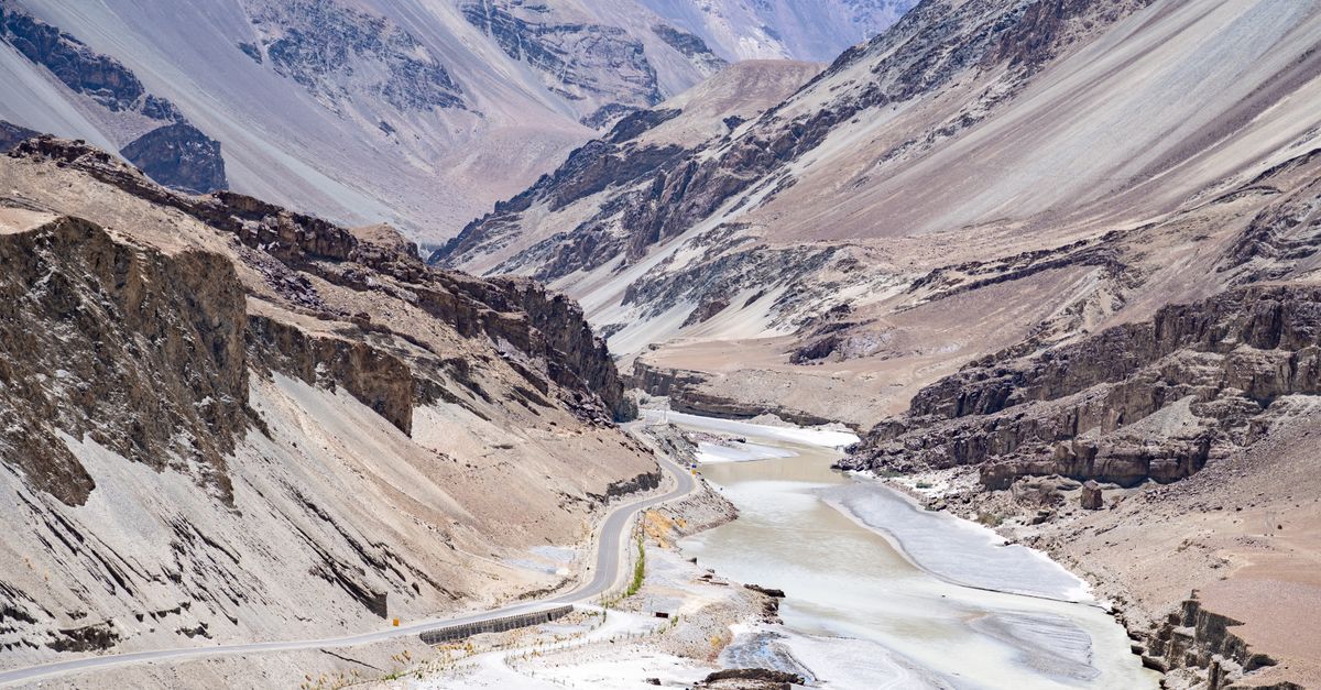 Remote Himalayan village with apricot trees and mountain backdrop