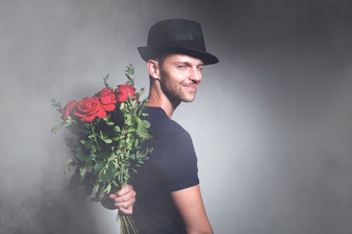 Man with Bouquet of Red Roses