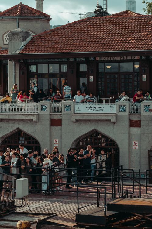 Free A lively crowd gathers outside a historic building in Istanbul, Turkey, capturing a blend of culture and architecture. Stock Photo