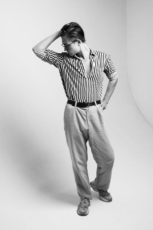 Black and White Studio Shoot of a Young Man Wearing Striped Shirt