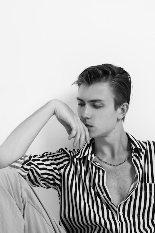 Black and White Studio Shoot of a Young Man Wearing Striped Shirt