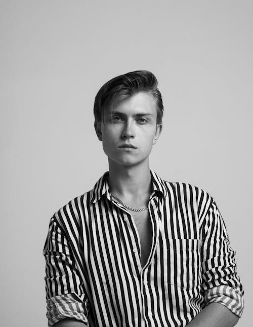 Black and White Studio Shoot of a Young Man Wearing Striped Shirt